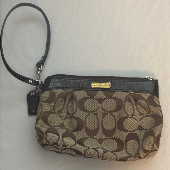 Coach Handbags - Coach Wristlet, signature pattern. New without tags.